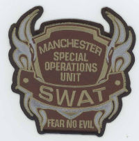 FOREIGN,ENGLAND,MANCHESTER SWAT SUBDUED 1